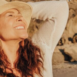 woman in white long sleeve shirt wearing white sun hat