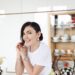 smiling woman sitting at table