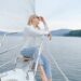 young stylish woman resting on sailboat